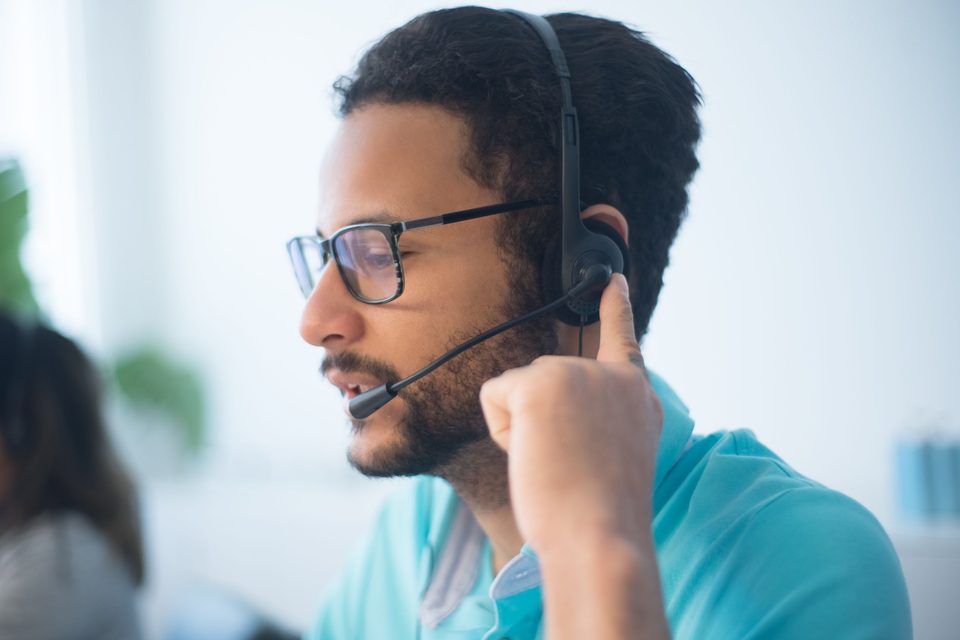Support specialist wearing a headset