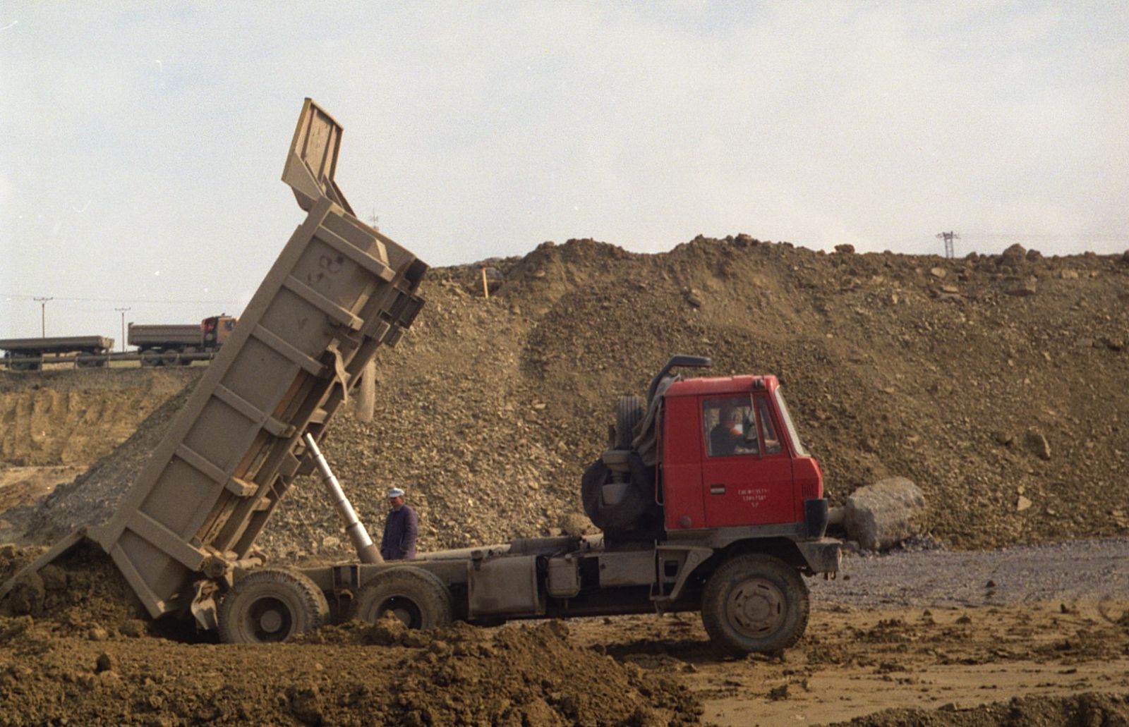 Tipper truck unloading soil